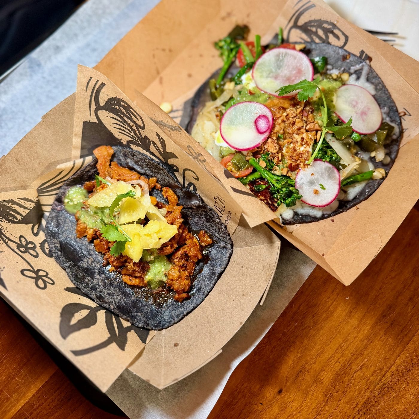 Al pastor taco and market vegetable quesadilla on blue corn tortillas at Corazon Cocina in Santa Barbara