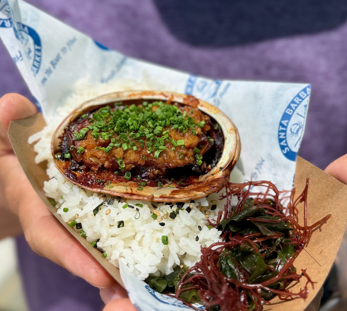 Soy and sake braised abalone with rice and seaweed salad at Cultured Abalone Farm in Goleta