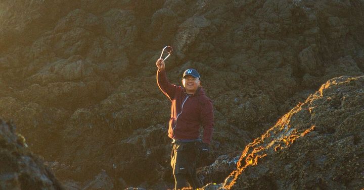 Foraging for purple sea urchin at golden hour on the rocky Mendocino coast at low tide