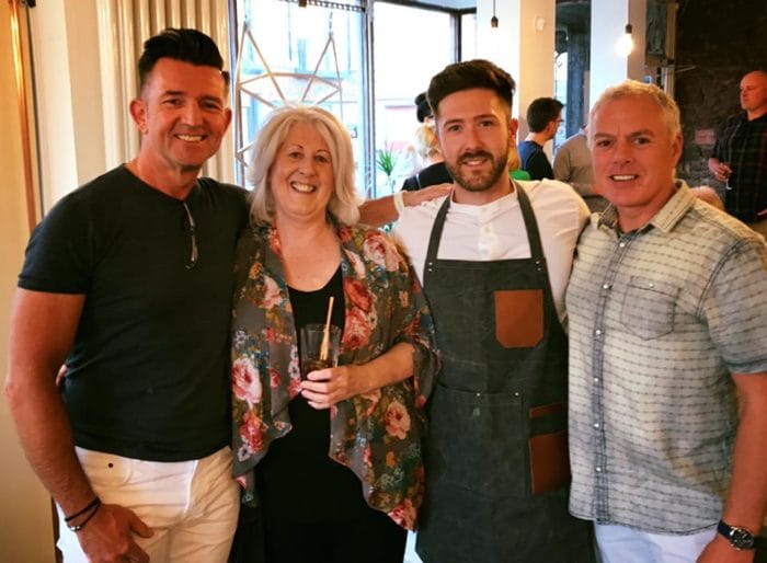 Tom Robinson-Parsons, second from right, with friends at preview night for Wolf & Lamb