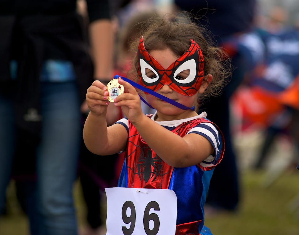 A proud medal winner at the BTR Kids Fun Run in 2015