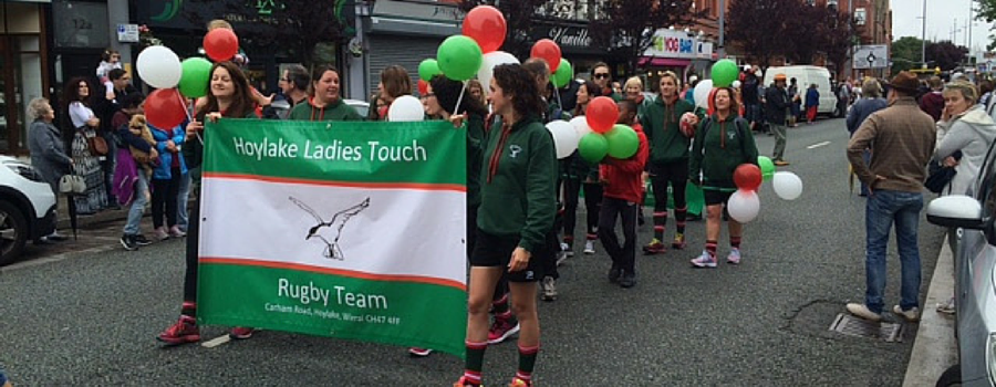 Rain fails to dampen spirits at Festival of Firsts parade