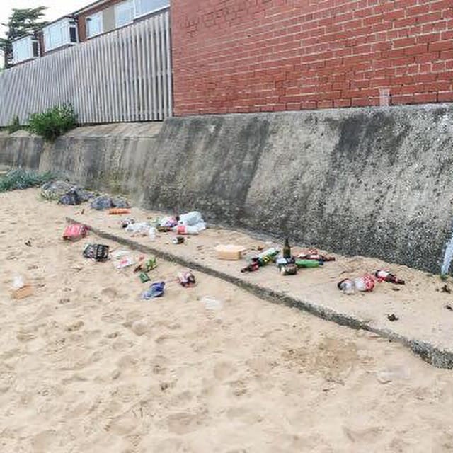 The beach strewn with litter