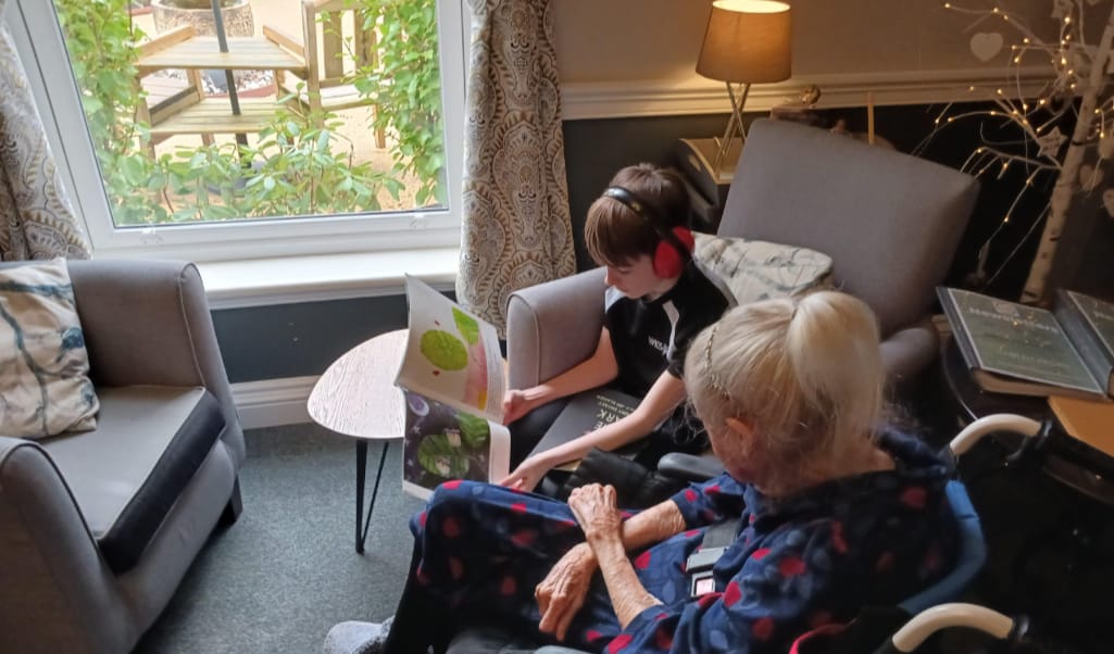 Students visit care home to read to residents