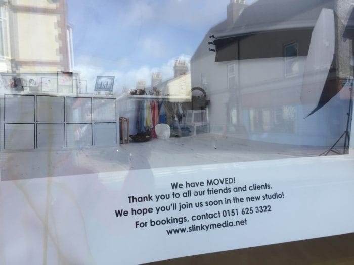 Notice in the window of Slinky Media
