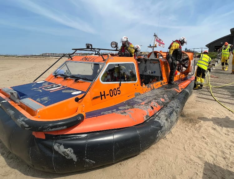 RNLI rescue walker stuck waist-deep in mud