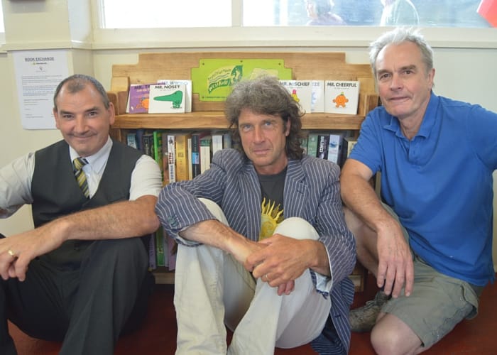Merseyrail staff member with Marko Muller and Tony Woof, from Transition Town West Kirby, who built the bookcase.