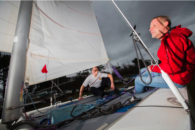 Yachtsman Will Thompson, right, on board his Dart 18 catamaran with the man who got him fit to sail again, Spire Murrayfield Hospital Physiotherapy Manager Christopher Buckley.