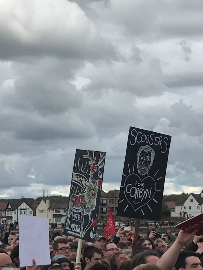 Signs in the crowd