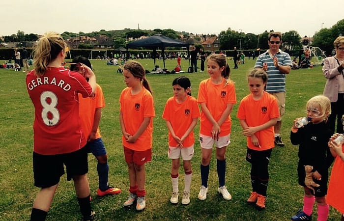 West Kirby WASPS girls picking up a medal