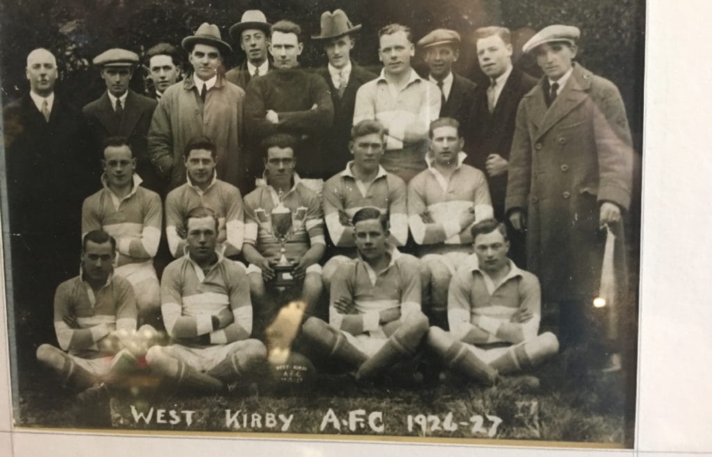 Dixie Dean (centre, with cup) with his cup-winning West Kirby FC colleagues in 1927