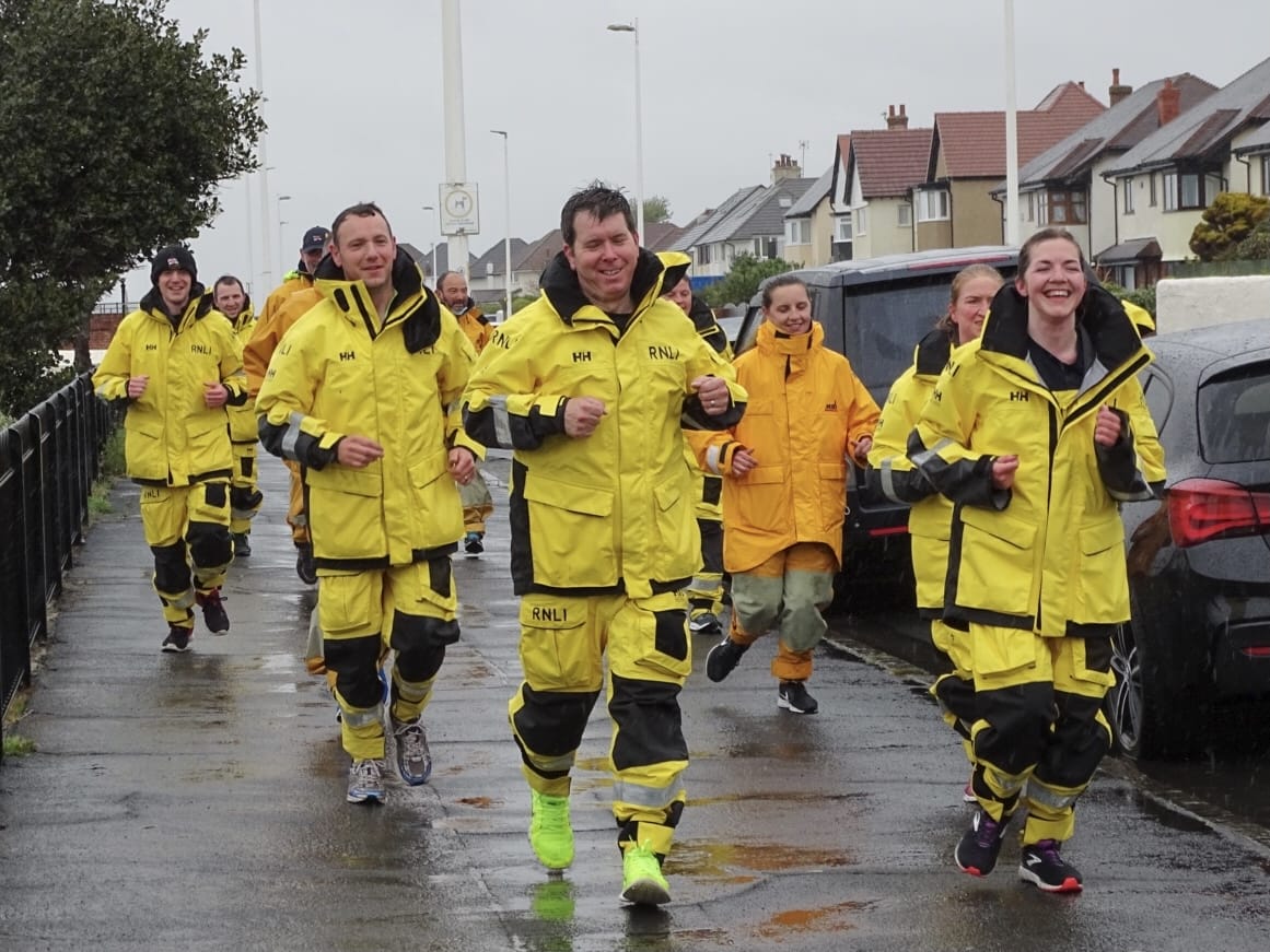 Hoylake RNLI volunteers raise thousands in rainy run