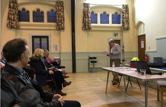 Mr Hutchinson addresses the meeting