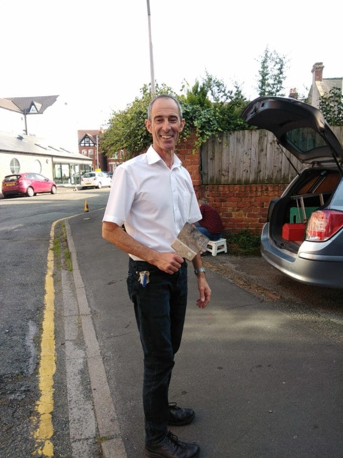 Members of West Kirby's small business owners' group tackle the weeding problem