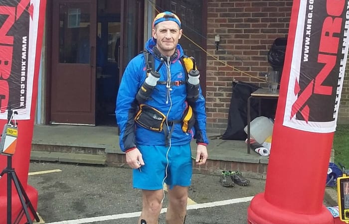 Lee Quinn at the finishing line of a "warm-up" ultra-marathon