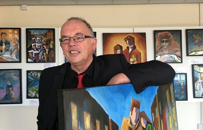 Artist Tony Kenwright at his "Visions of Bob Dylan" exhibition