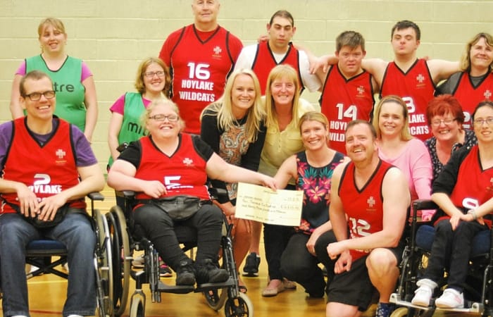 Hoylake Wildcats with their cheque from the DWP