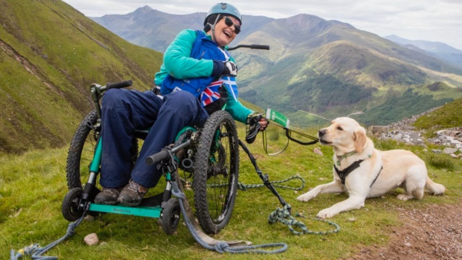 Mary Lamb and her assistance dog, Sheldon.