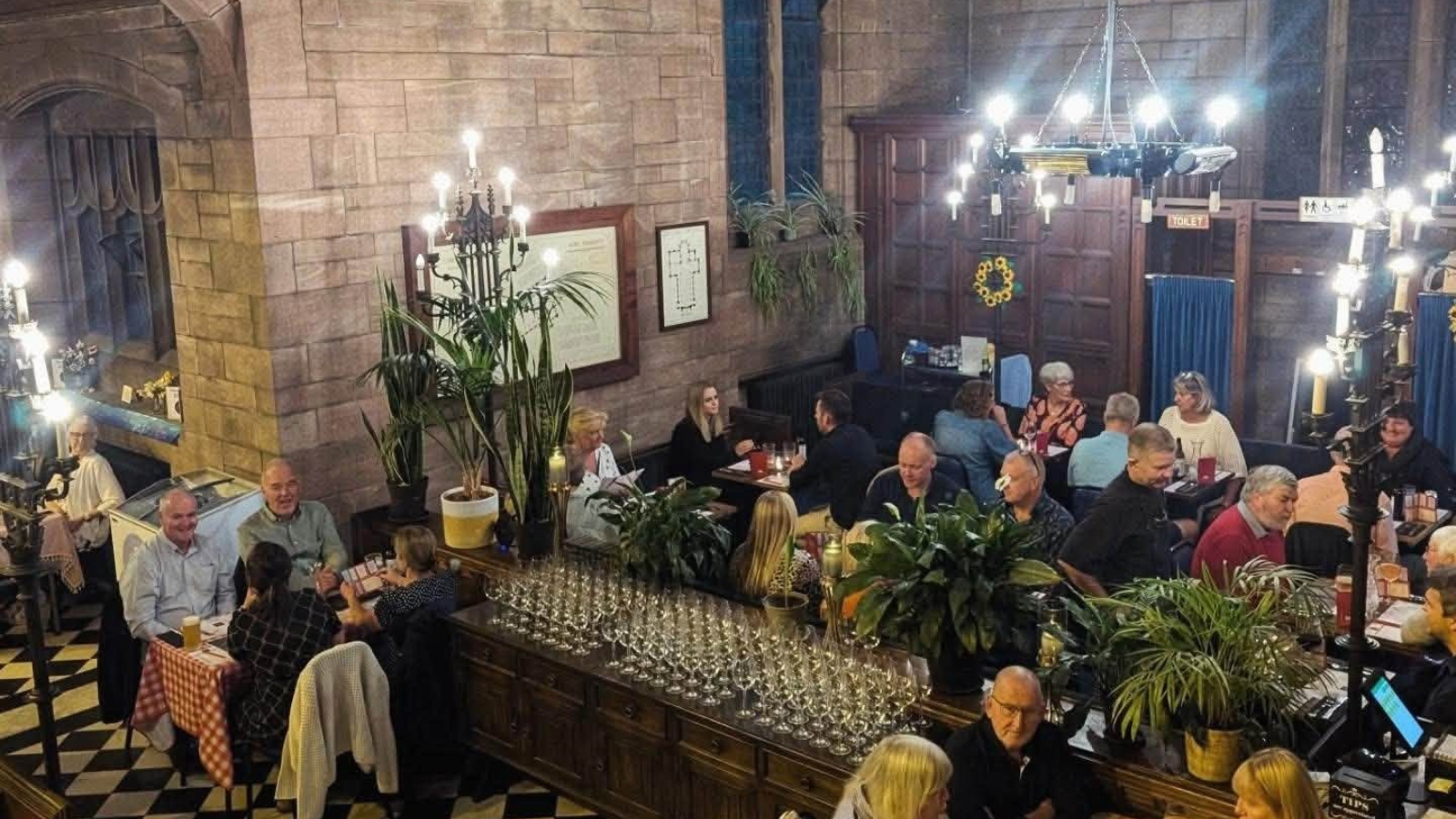 People eating at Manna's Bistro inside Christ Church, Port Sunlight.