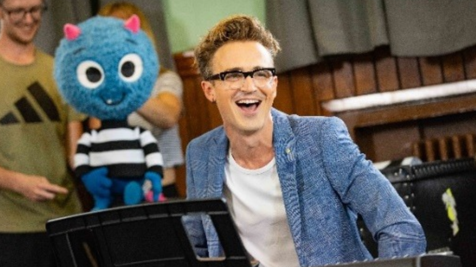 Tom Fletcher and one of the monster puppets for There's a Monster in Your Show.
