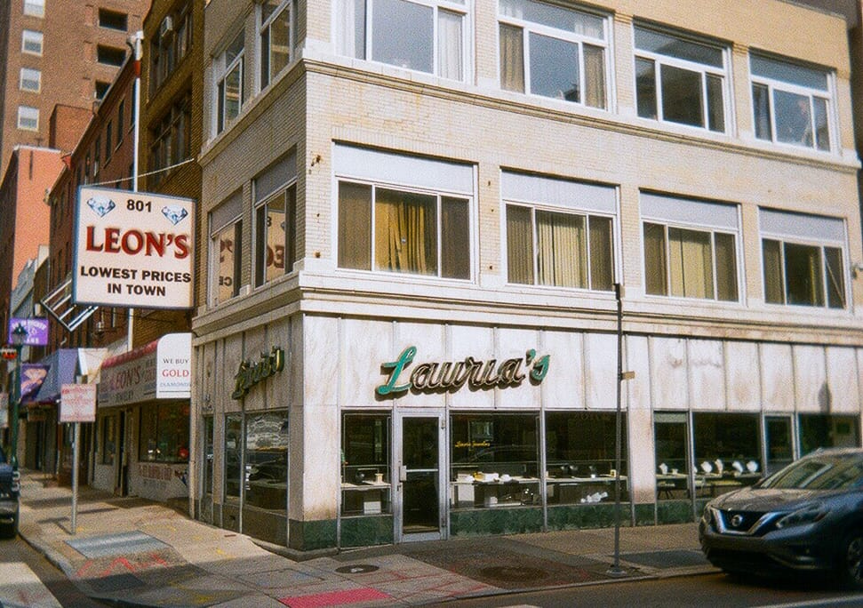 a street corner in Philadelphia with old-school building signage