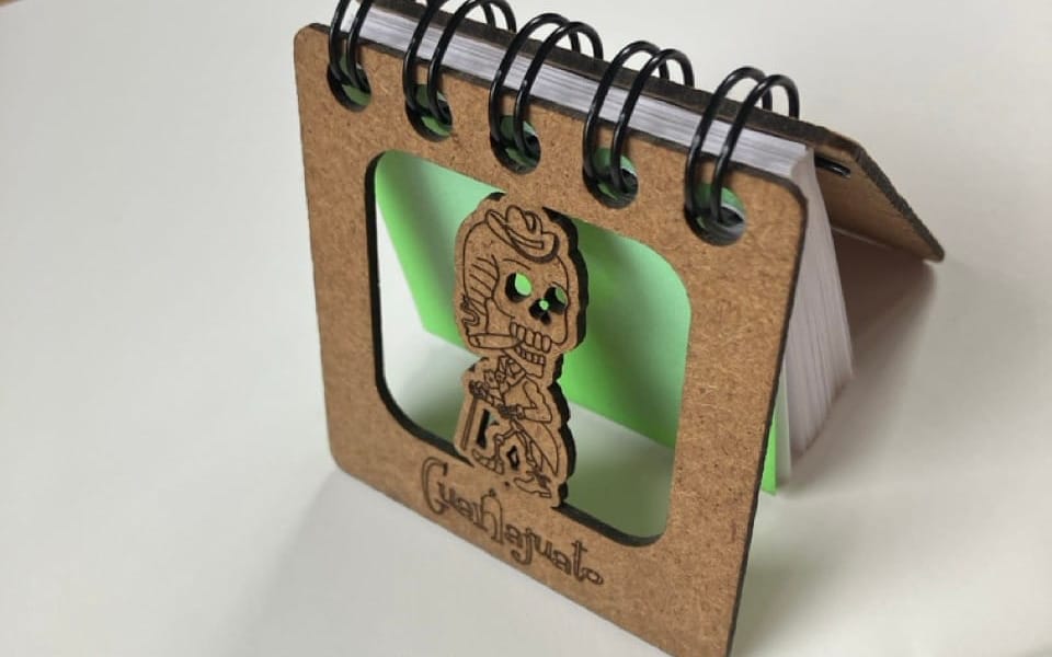 a color photo of my Guanajuato Day Journal featuring a smoking skeleton engraving on pressboard cover