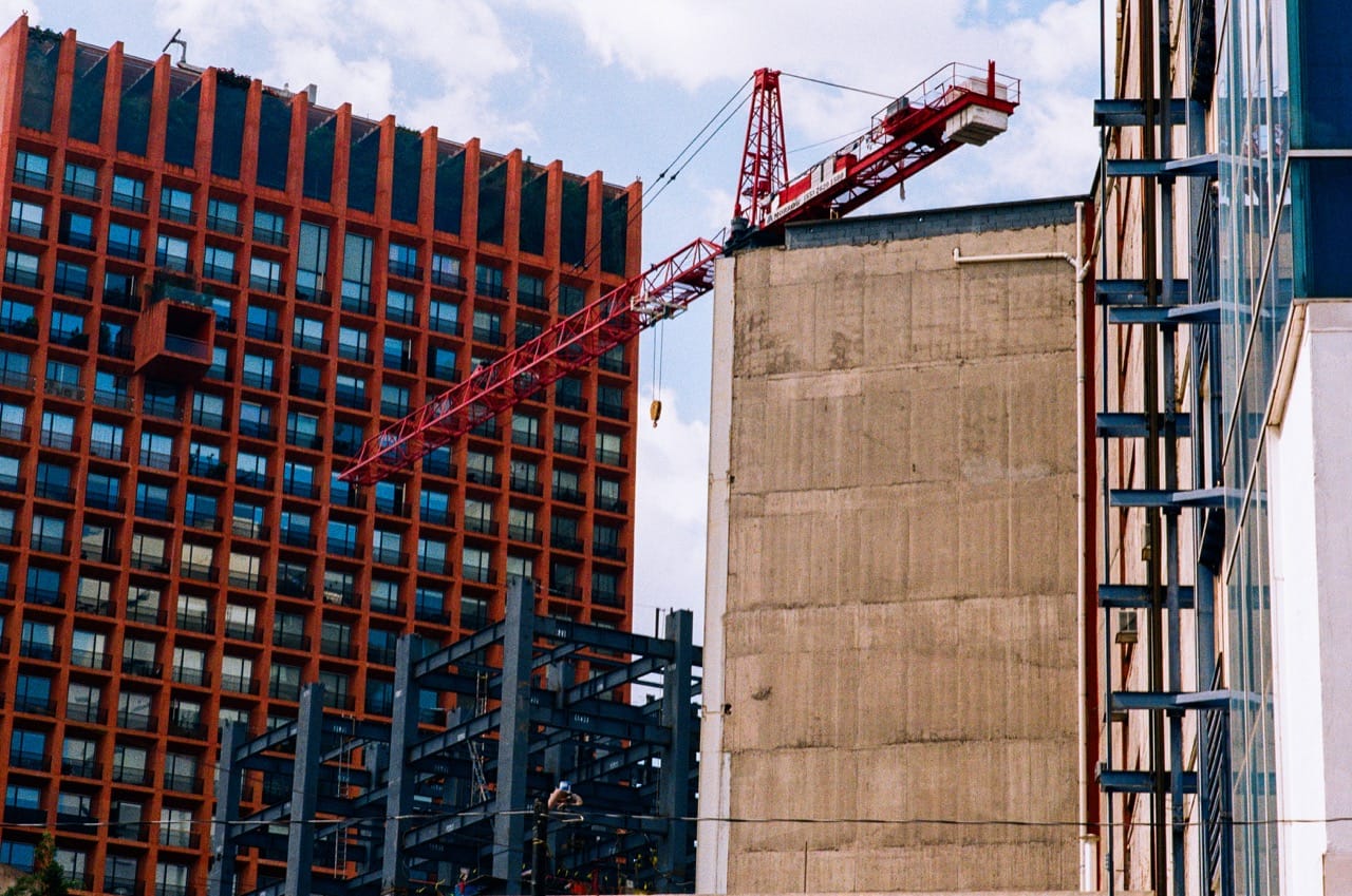 a color photograph of high-rises in Mexico City under various phases of construction.