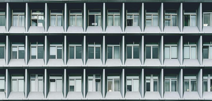 Enterprise AI governance framework for Australian organisations — symmetrical corporate building facade representing structured institutional oversight and regulatory alignment.