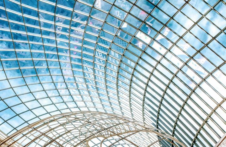Glass ceiling architecture symbolising interconnected enterprise systems and AI platform integration.