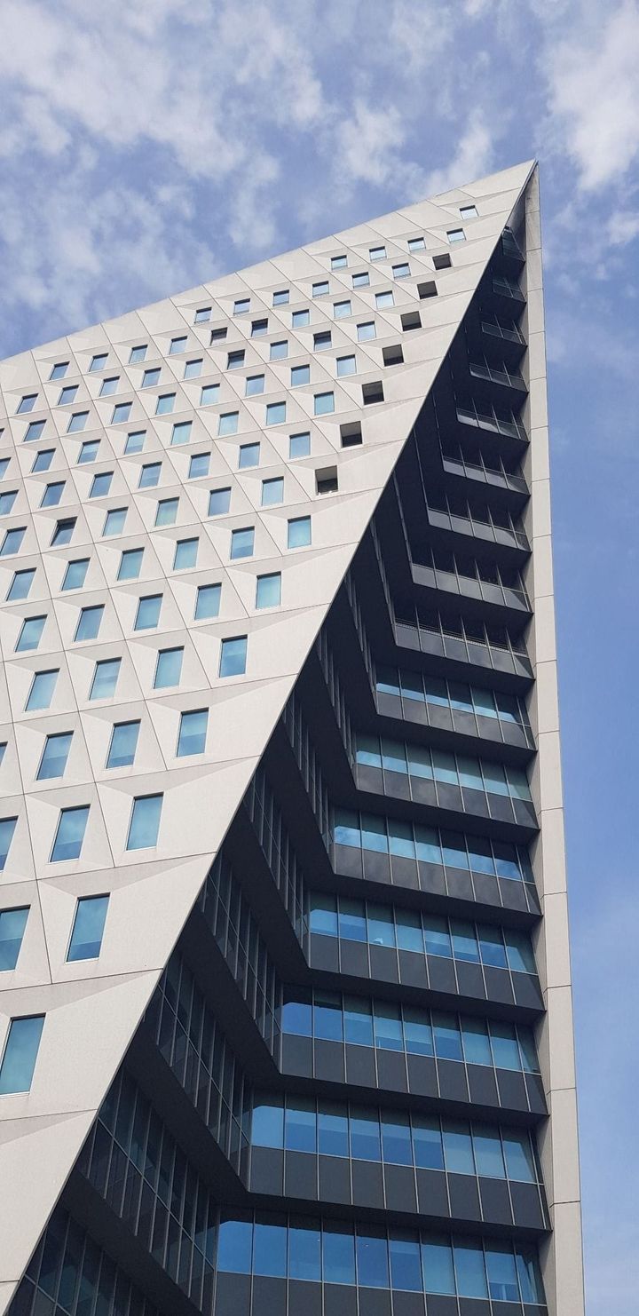 Modern corporate office building representing enterprise AI adoption, governance challenges and shadow AI activity within organisations.