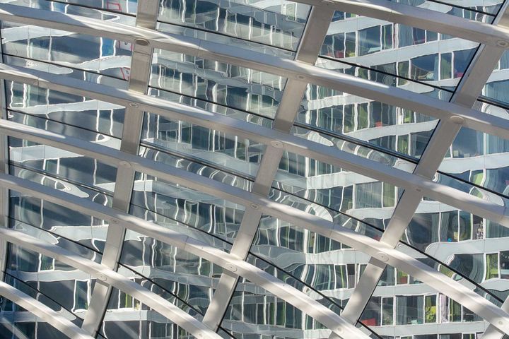 Modern office architecture with interconnected structural layers, representing enterprise AI operating models, system integration, and organisational capability.