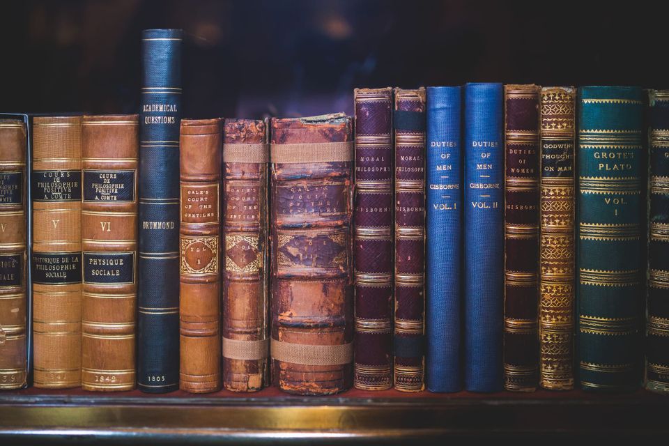 A shelf full of leather-bound philosophical tomes.
