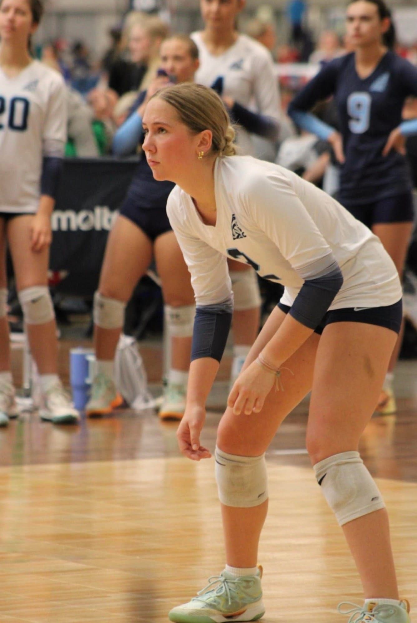 Alexandra Sitler warming up on the volleyball court before a match.