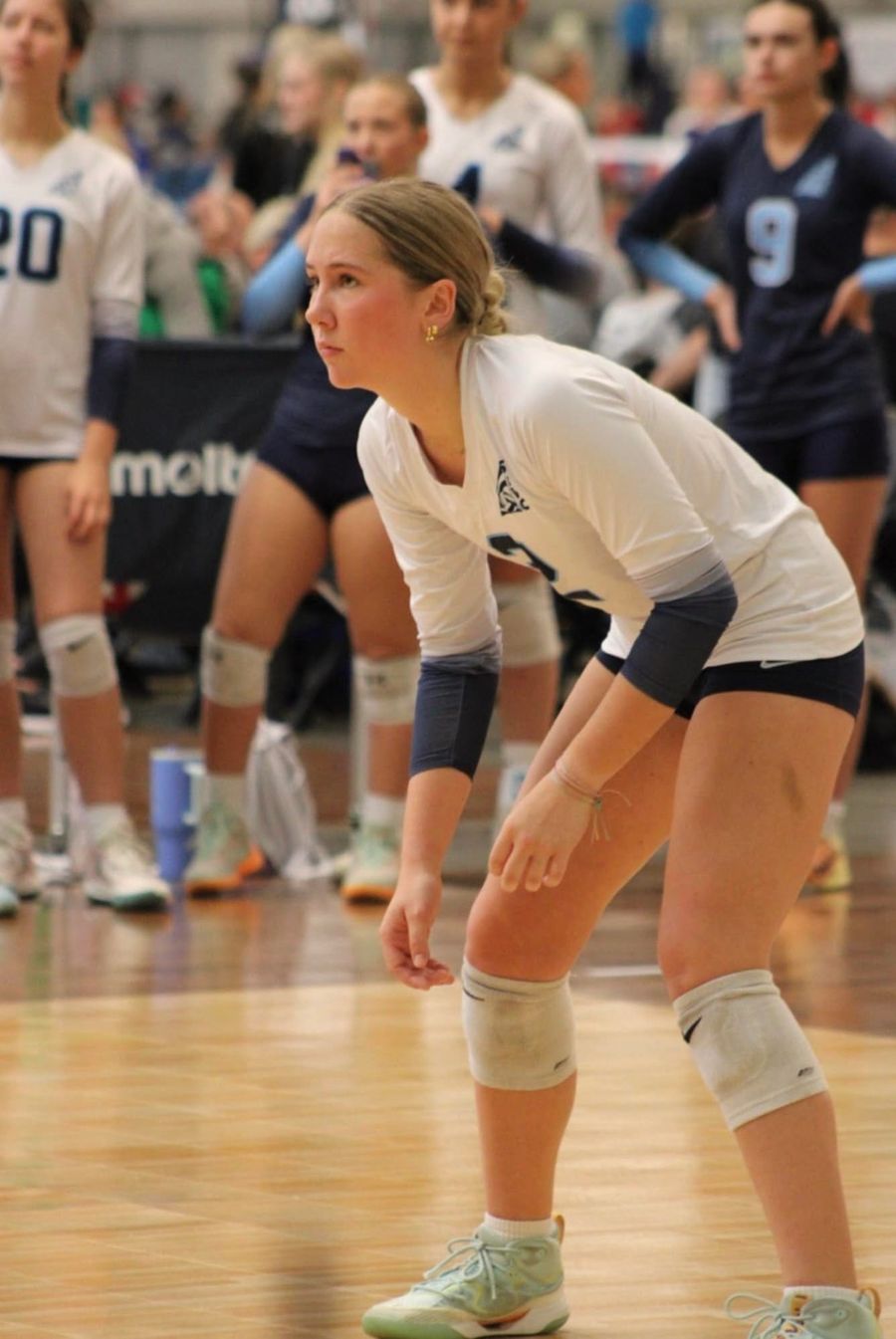 Alexandra Sitler warming up on the volleyball court before a match.