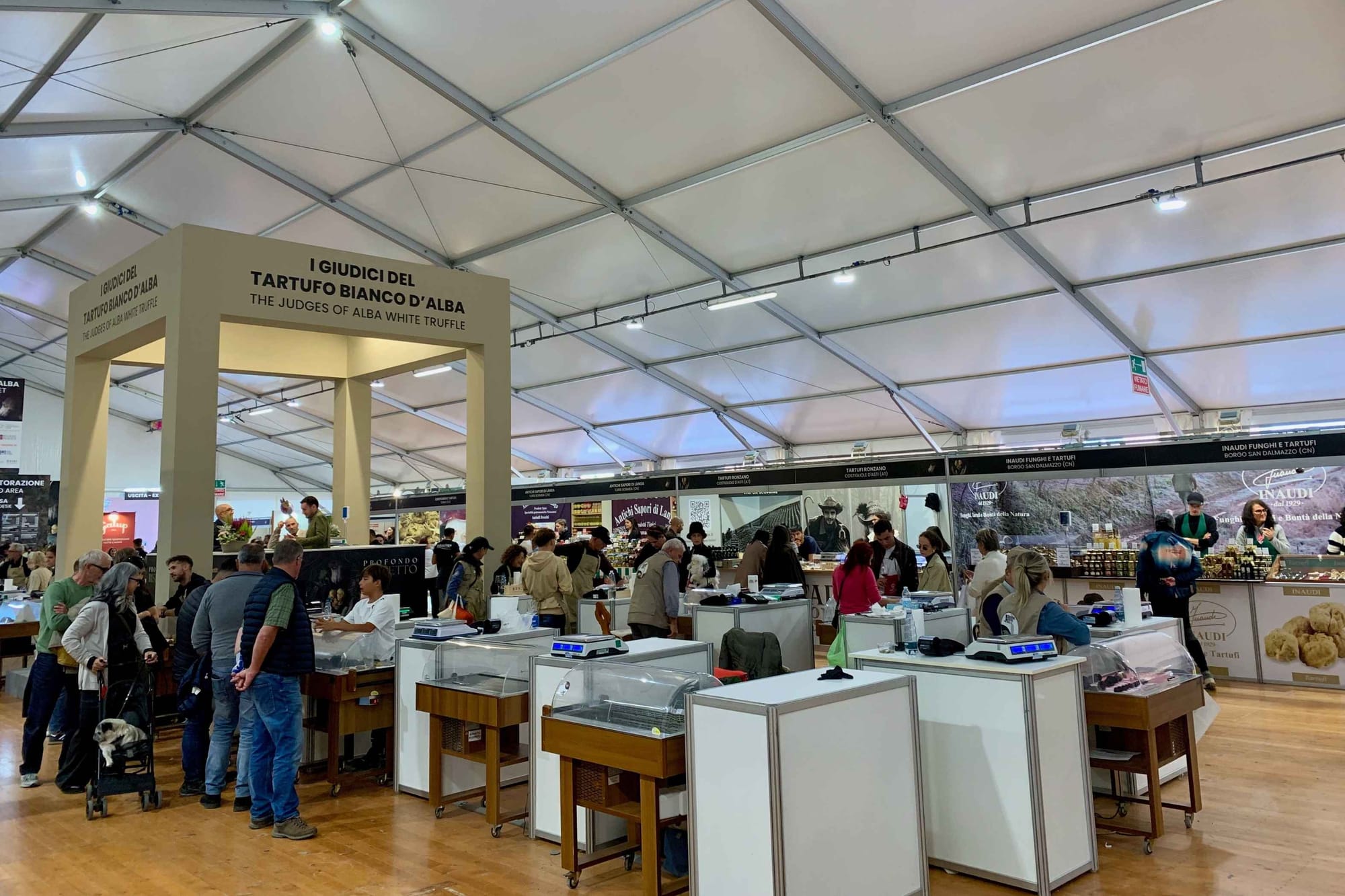 Truffle stands and judges inside the Alba White Truffle World Market.