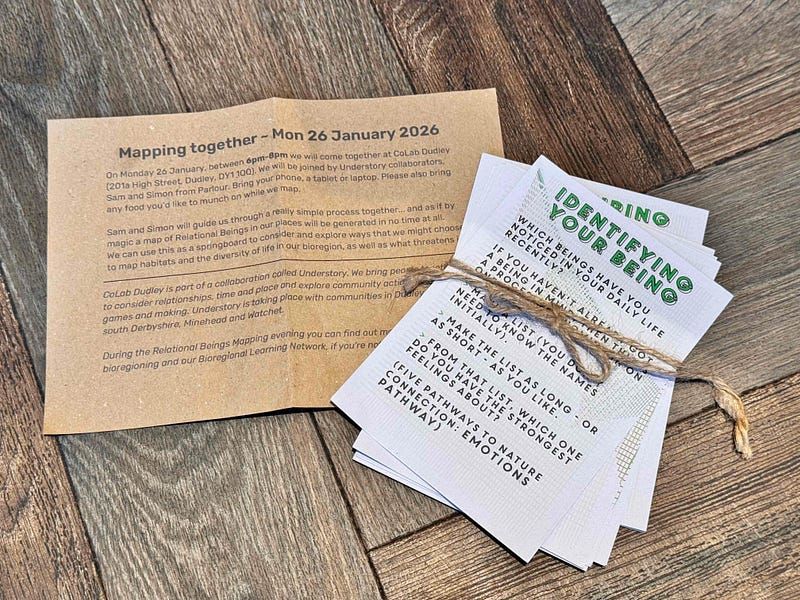 The relational beings invitation to map together on brown paper, along with the practice prompt cards in grey and green that