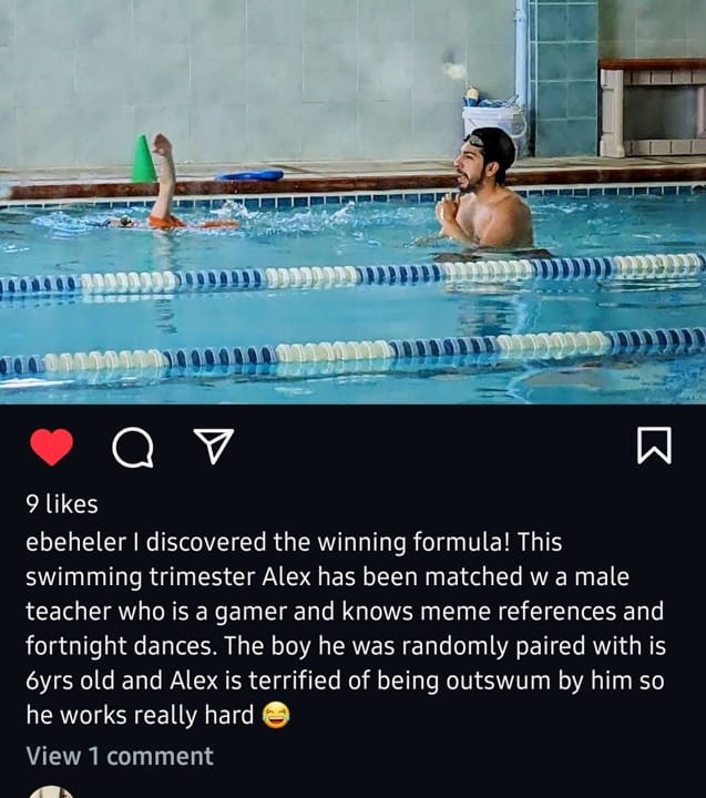 Instagram post. Picture is of a swimming pool, divided into lanes, with a man teaching a young boy to swim.
