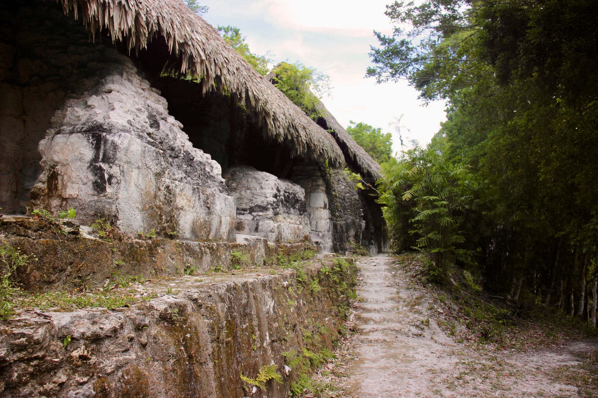 A footpath passes to the right of a large staircase-like monument