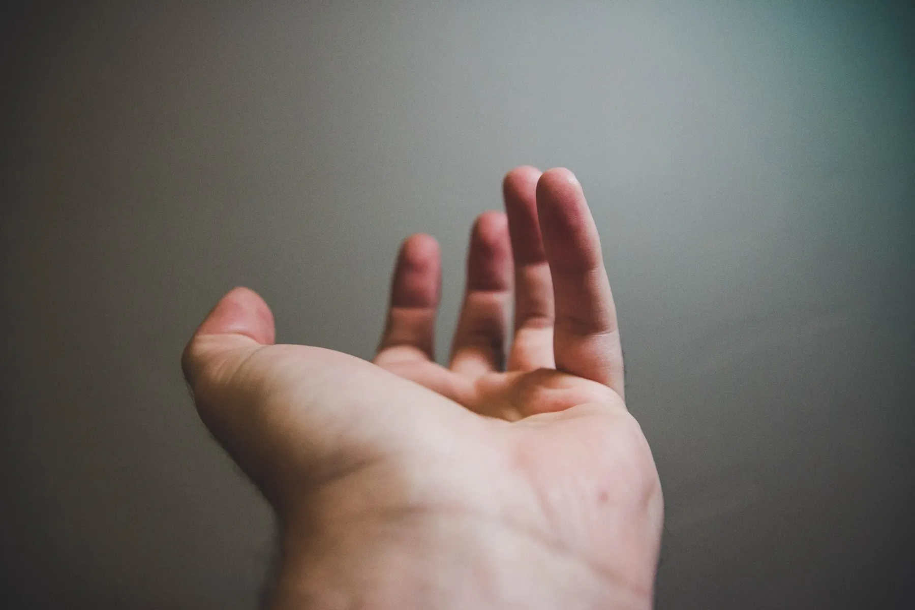 A hand reaching out.