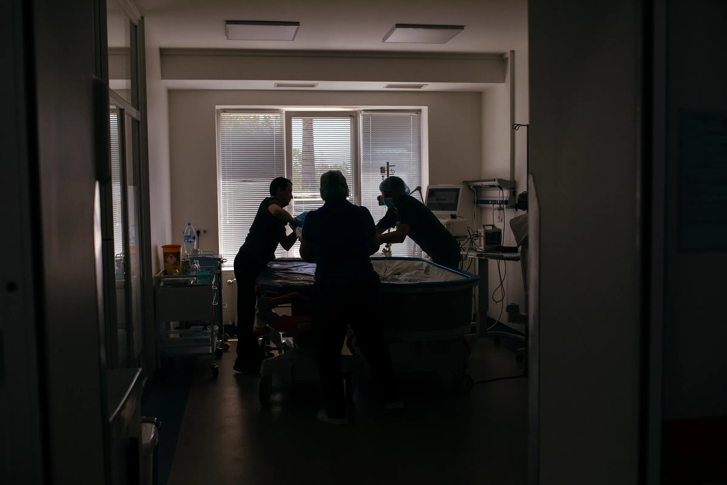 Nurses prepare a surgery room