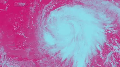 An image on a pink background shows a the formation of a hurricane.