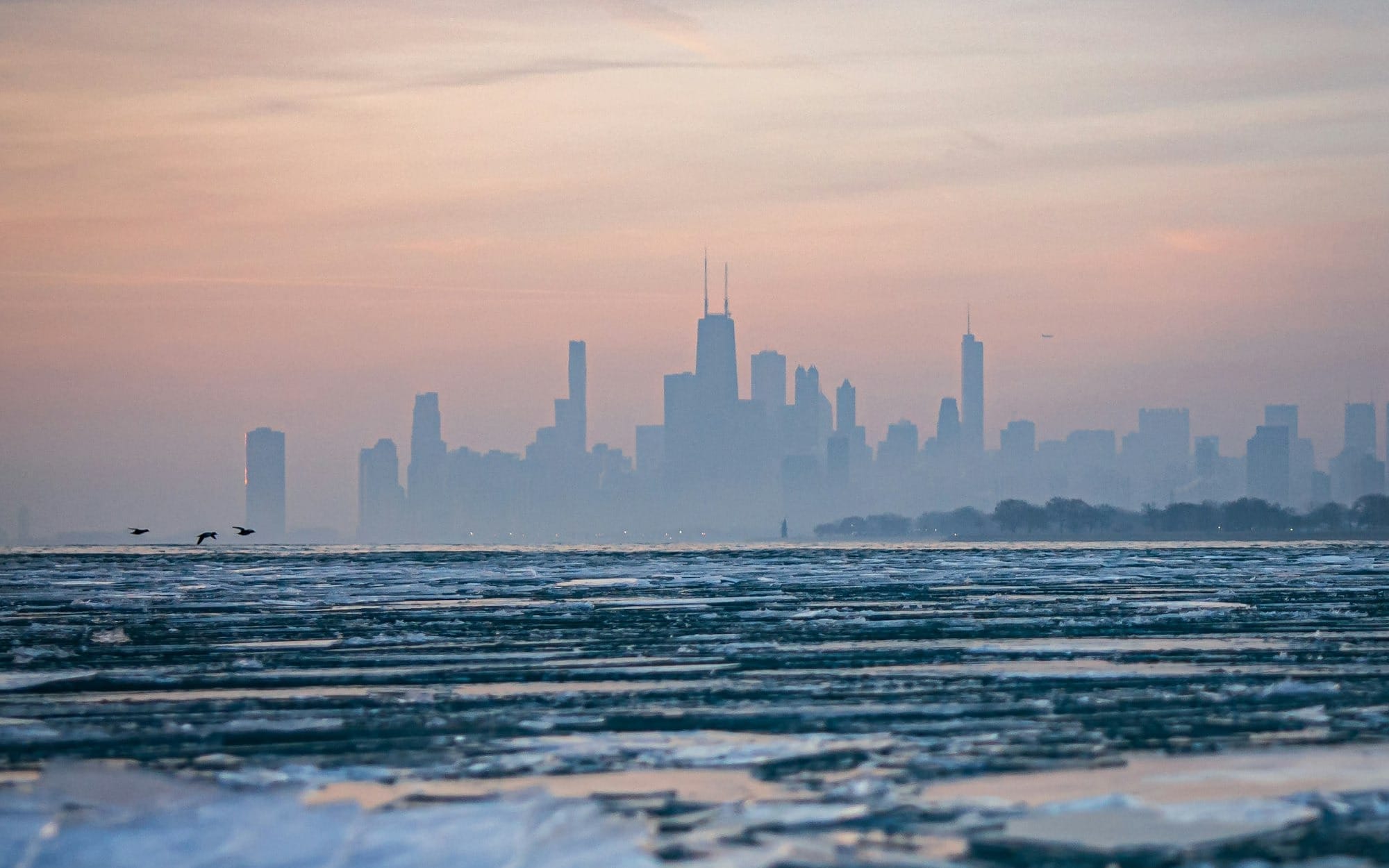 a view of a city skyline from the ocean