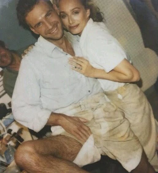 Kristen Scott Thomas looking sloppy and hot with an equally sloppy, hot Ralph Fiennes in their English Patient costumes.