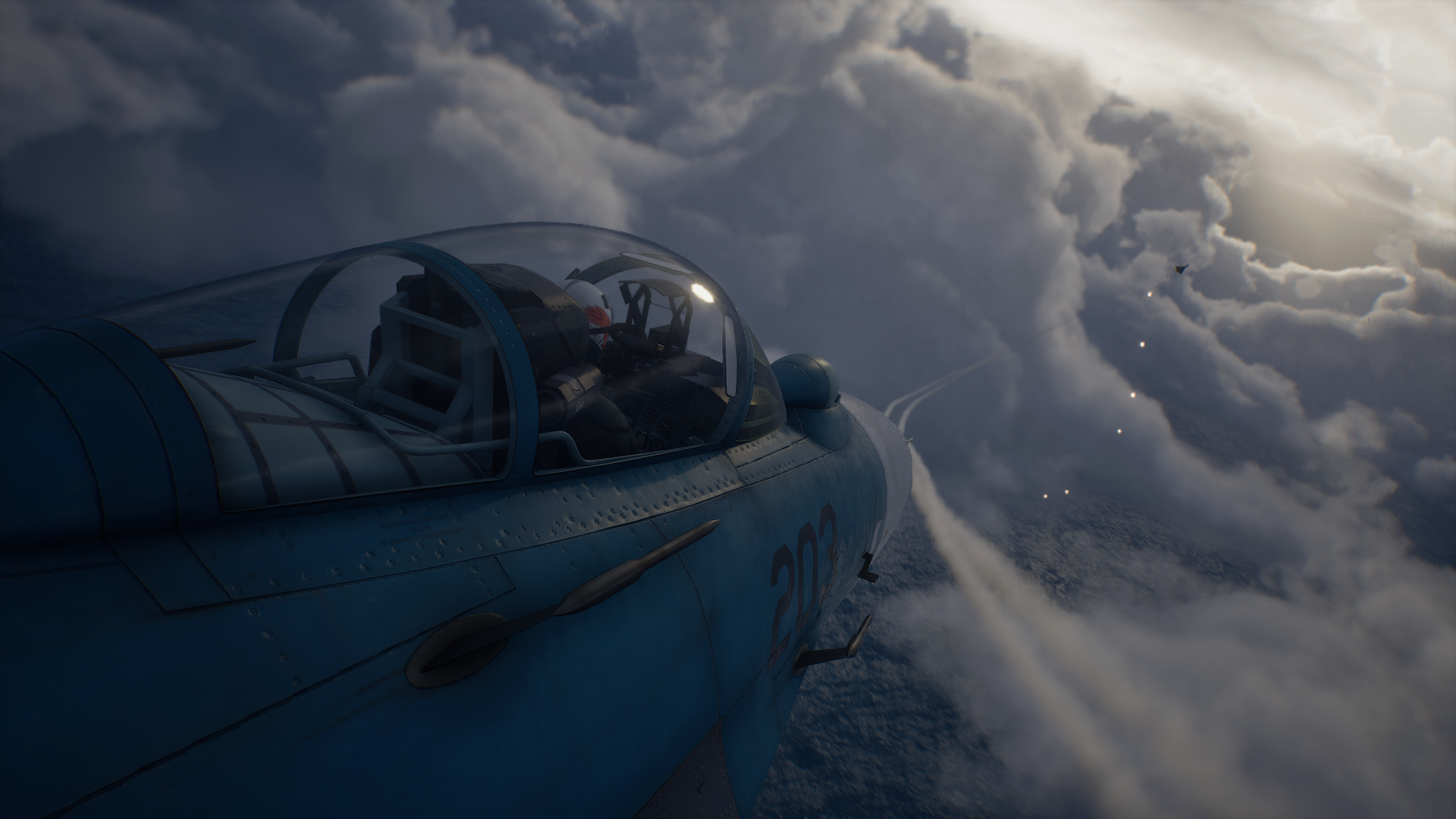 An exterior shot from the starboard fuselage of a fighter looking over the pilot's shoulder in the bubble of the canopy as missiles streak away toward the silhouette of a distant delta-wing aircraft trailing flares in the dusky light.