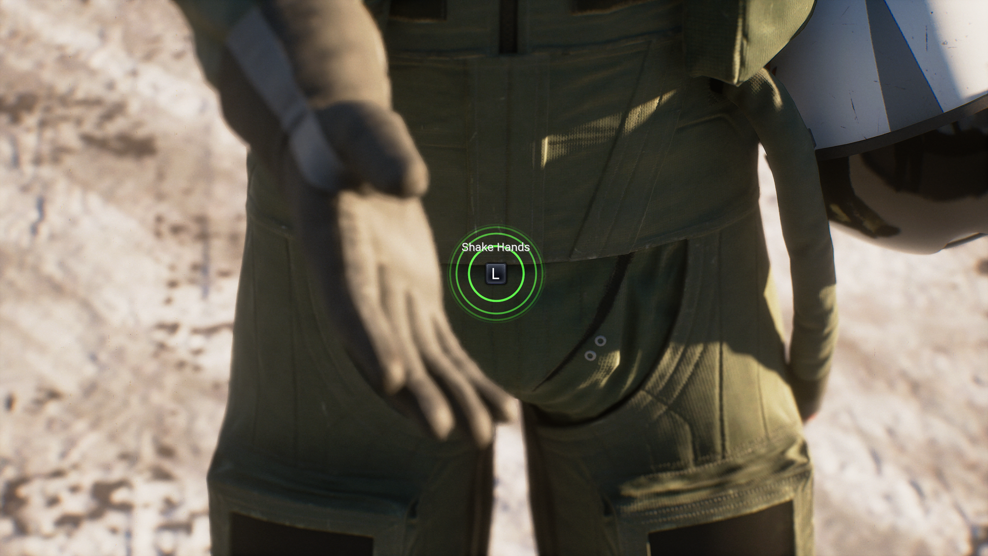 A "press L to shake hands" prompt over an blurry extended hand and a perfectly in-focus crotch.