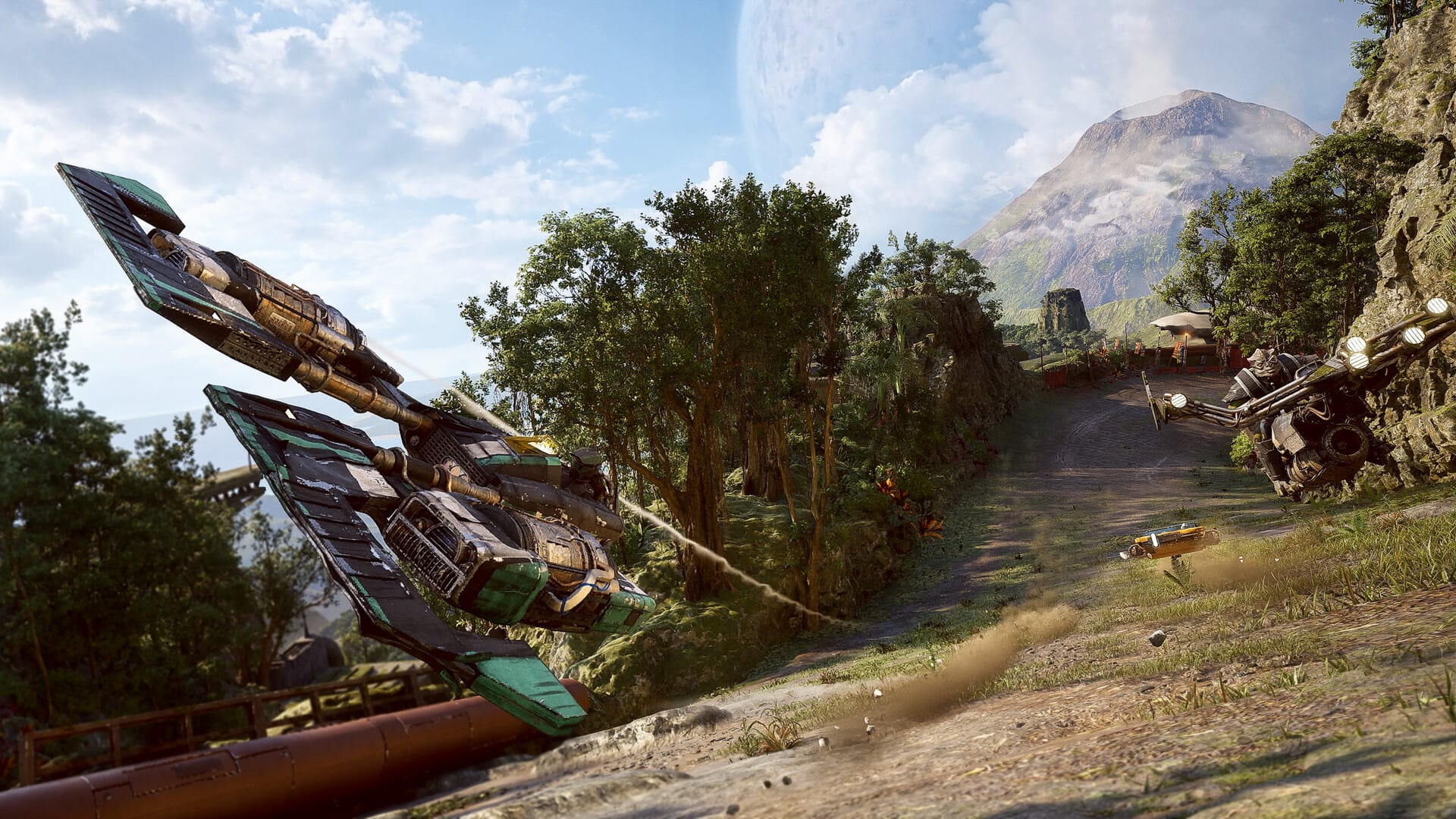 A trio of Star Wars racing speeders exit a banked corner facing the camera as a volcano rises from the jungles behind