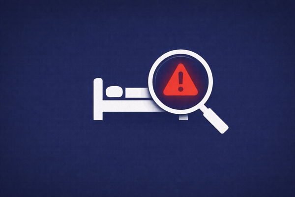 Minimalist vector art of a hotel bed icon under a magnifying glass revealing a warning symbol, representing the Booking.com data breach investigation.