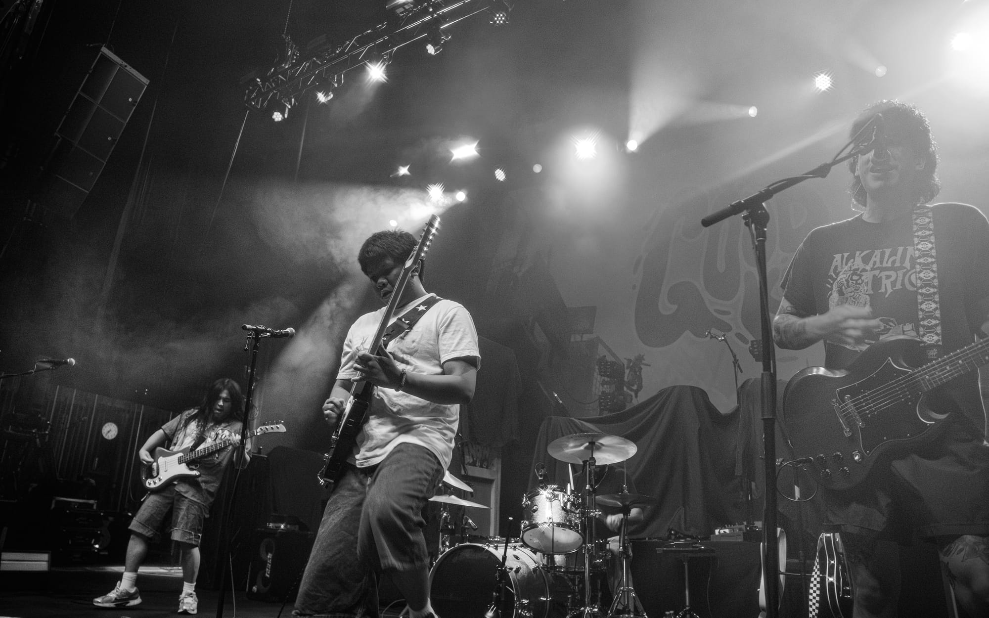 4-piece band INOHA playing for the crowd, featured in this black and white photo.