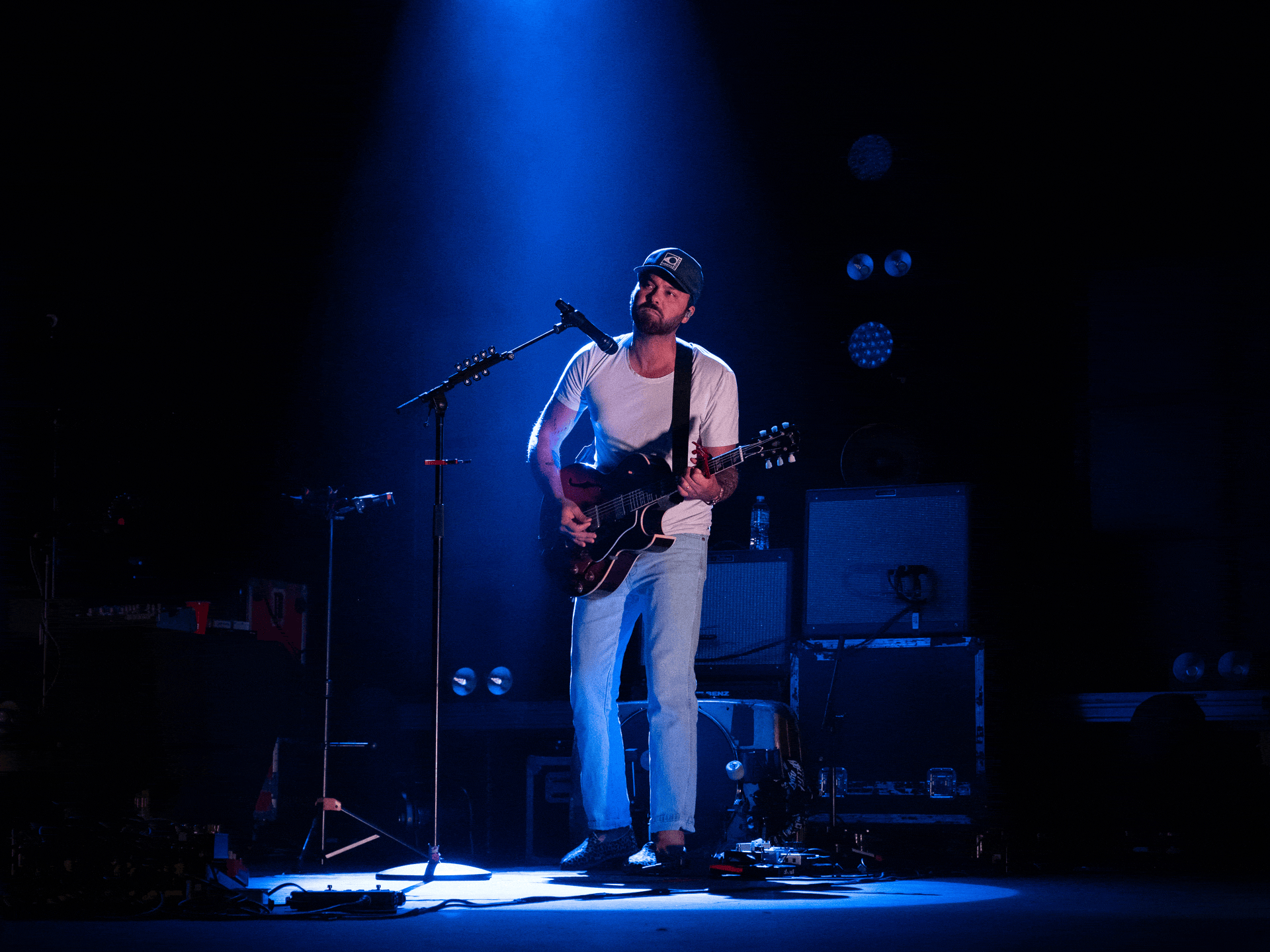 Shakey Graves playing guitar and a one-man drum setup.