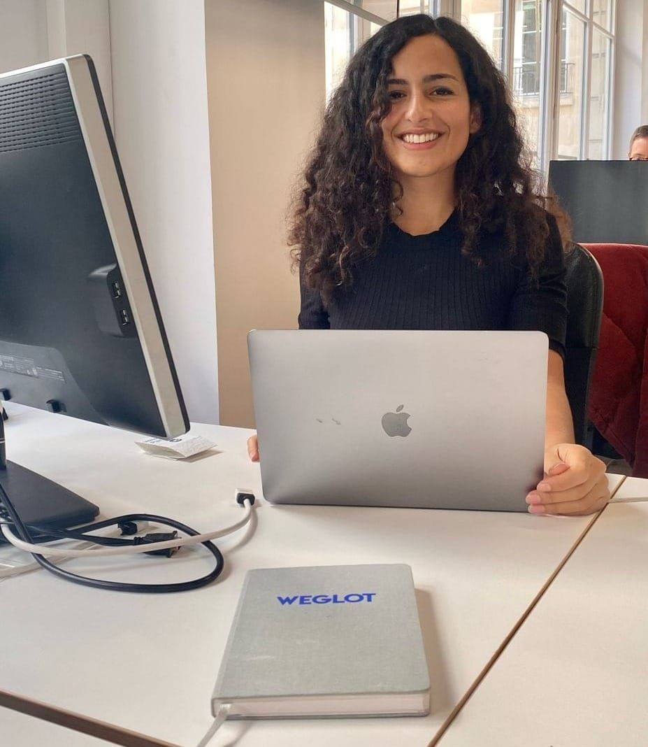 this image shows a woman named Laura Gutierrez smiling in her office at Weglot